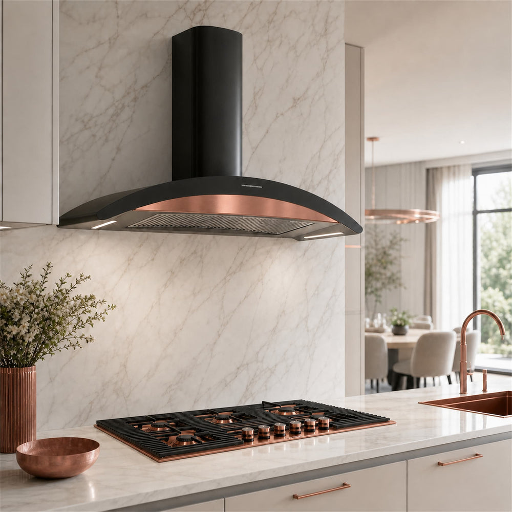 A modern kitchen scene featuring a black range hood with a copper-coloured inner trim