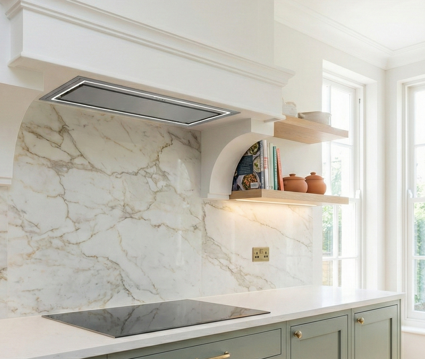 Caporra Stainless Steel Integrated Canopy Hood in a Luxury Kitchen with Calacatta Marble Backsplash and Sage Cabinets