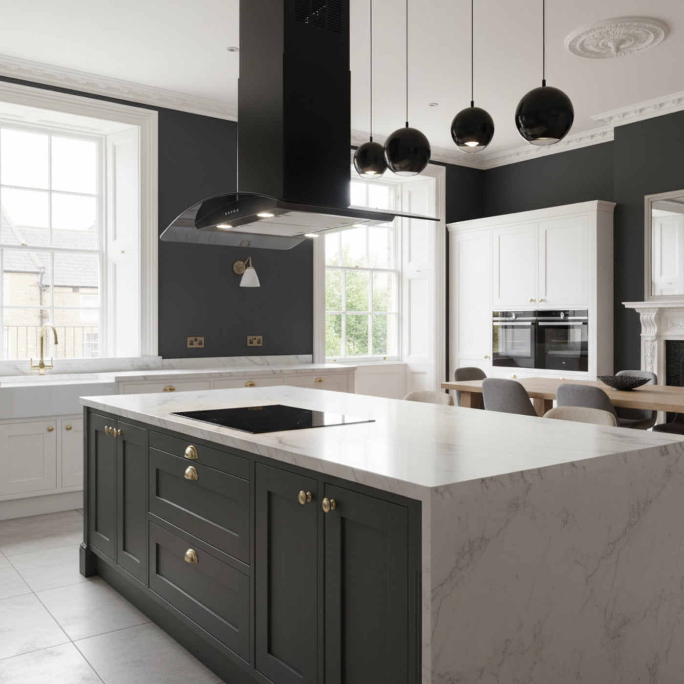90cm curved glass island cooker hood in black in a feature black and white kitchen comprising of a large marble island and induction hob