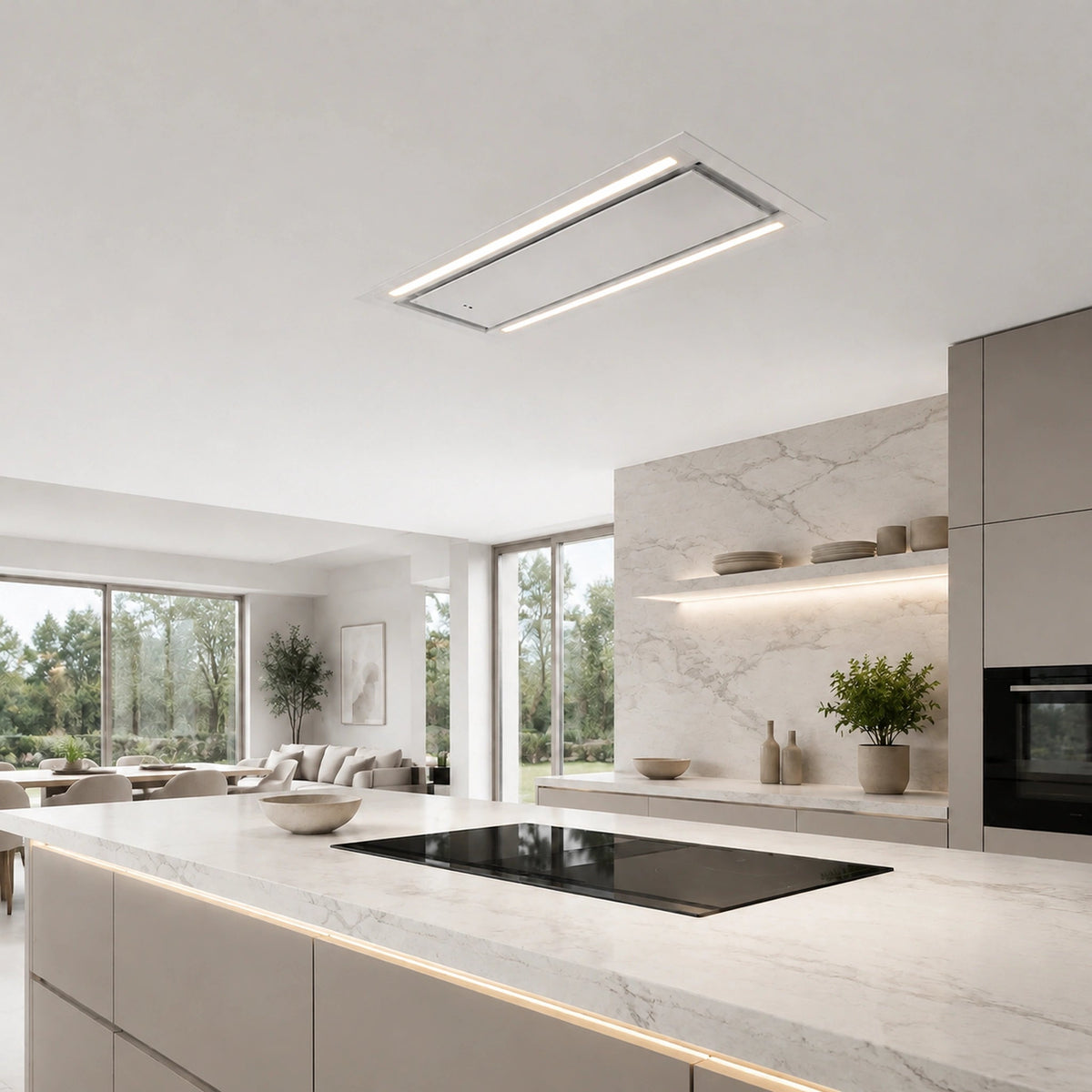 A modern kitchen interior with a MIRA ceiling-mounted cooker hood featuring a slim white LED strip, set against white cabinetry and a marble backsplash.