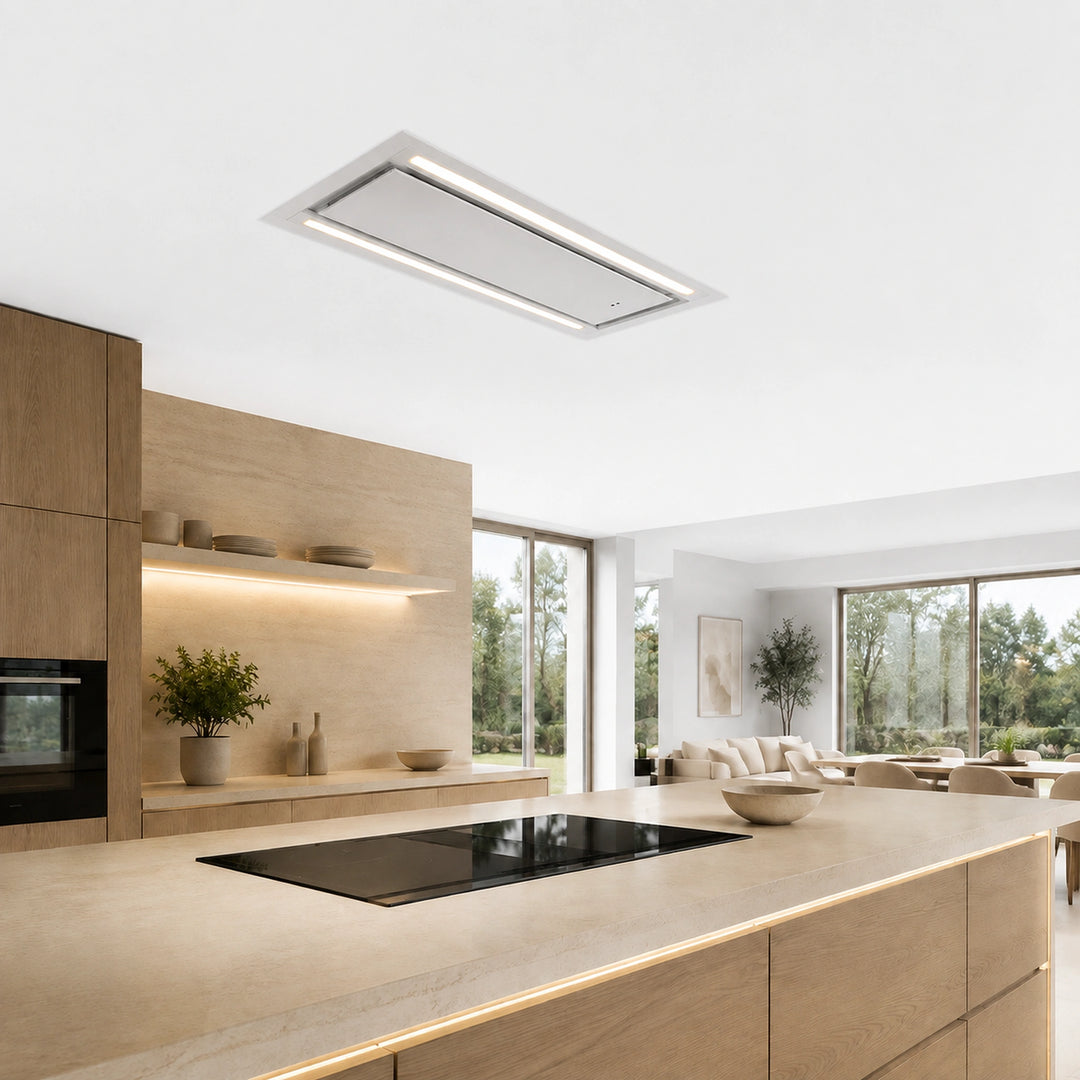 A modern MIRA ceiling-mounted cooker hood with integrated LED lighting, shown installed in a bright, contemporary kitchen with light wood cabinetry and large windows.